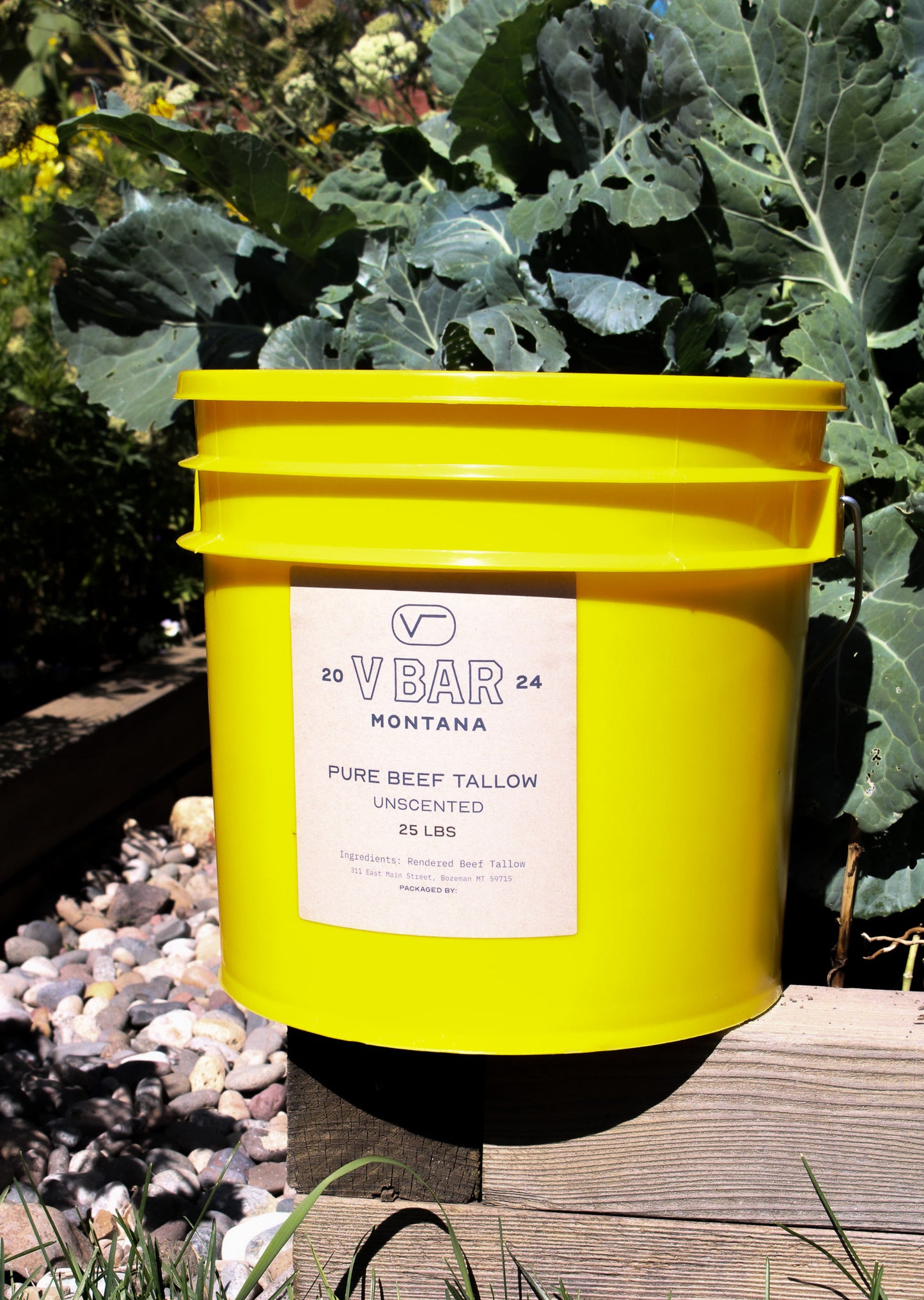 A yellow 3.5-gallon bucket labeled with VBar Montana pure beef tallow