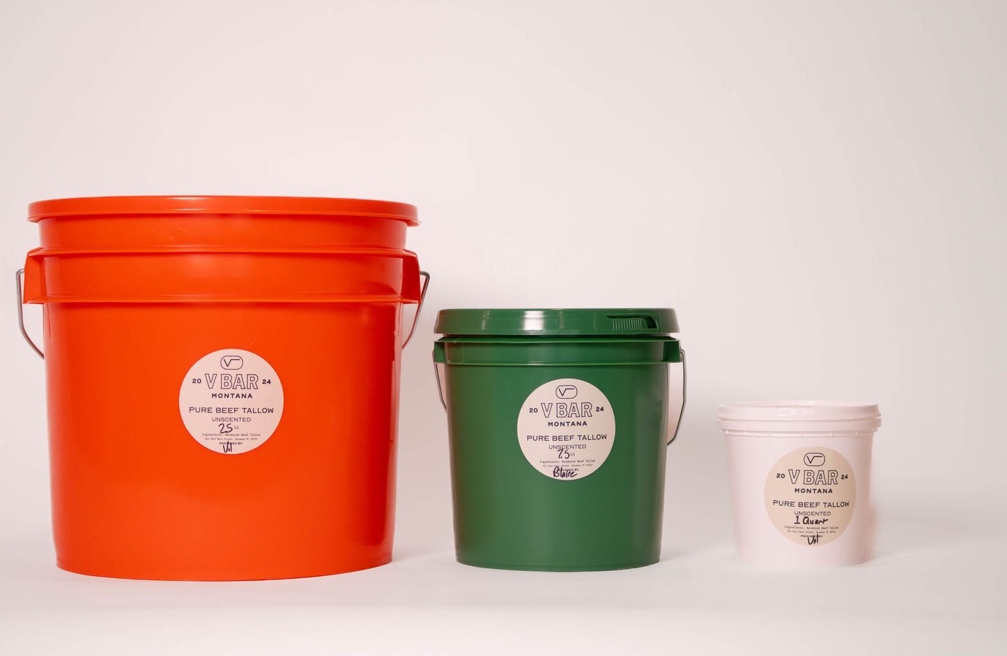 Three buckets of tallow three gallon: orange, one gallon: green, quart: white