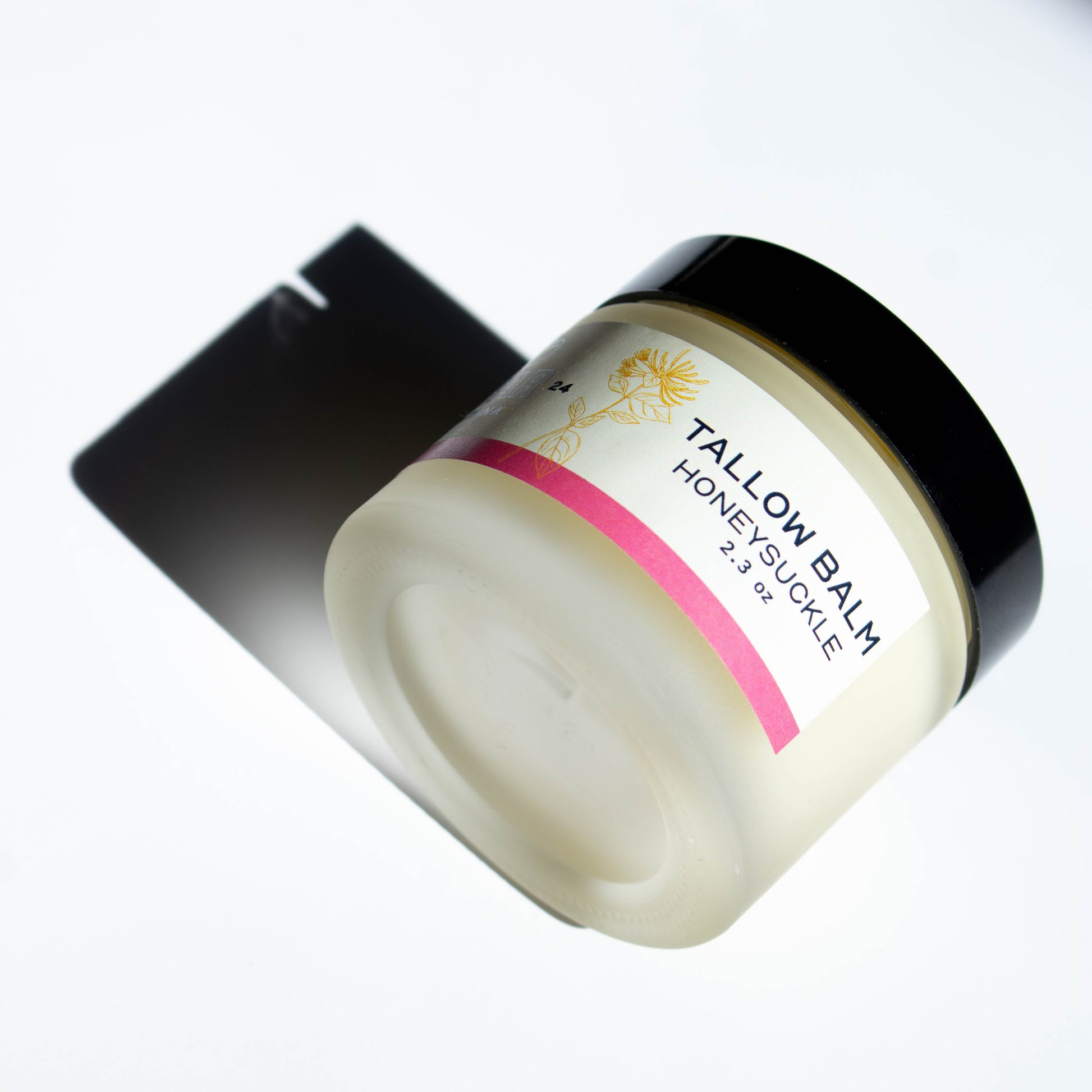 jar of Vbar Montana honeysuckle tallow balm, made from grass fed beef suet 