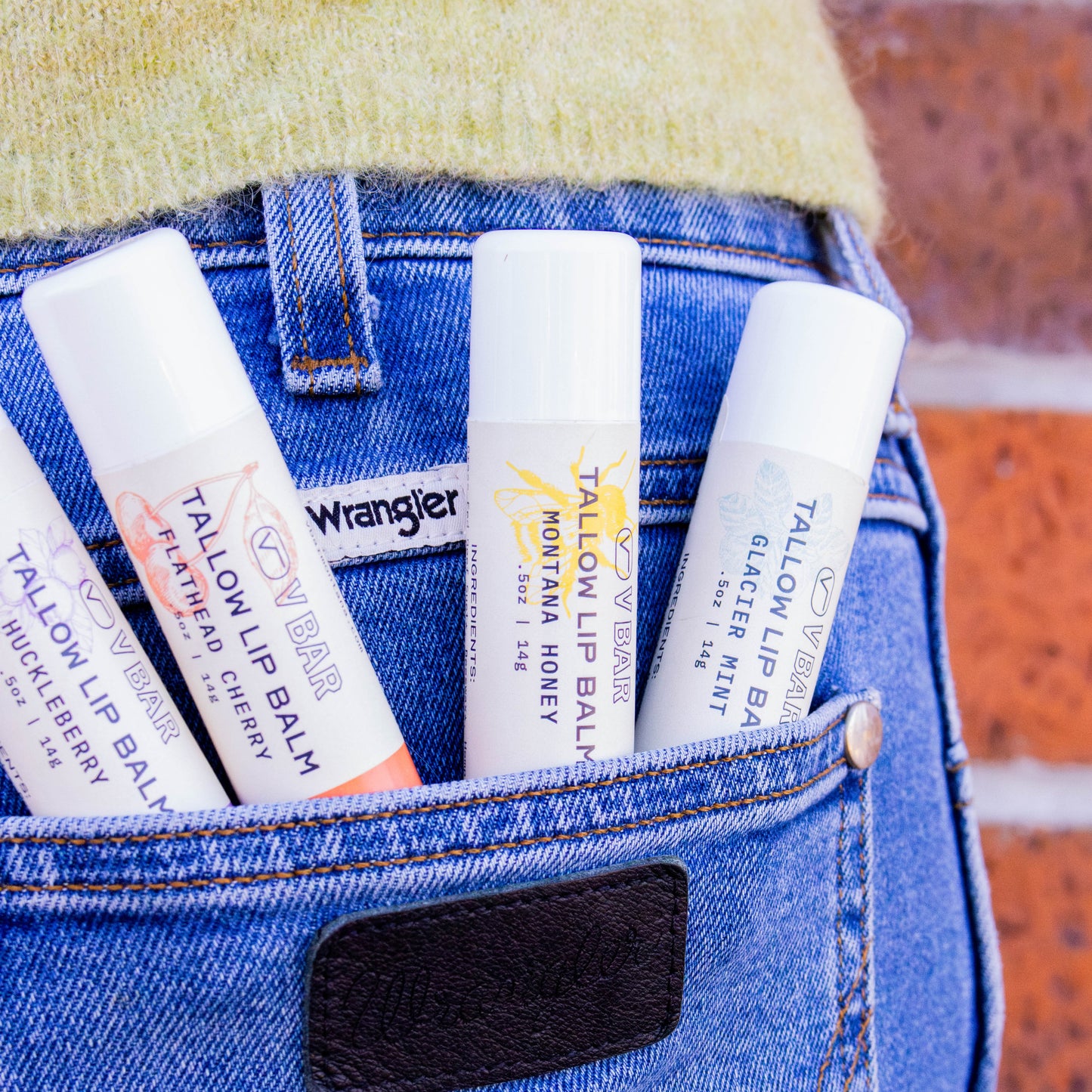 Natural tallow lip balm made from grass-fed beef suet for dry lips and sourced from Montana ranches in the pocket of Wrangler jeans