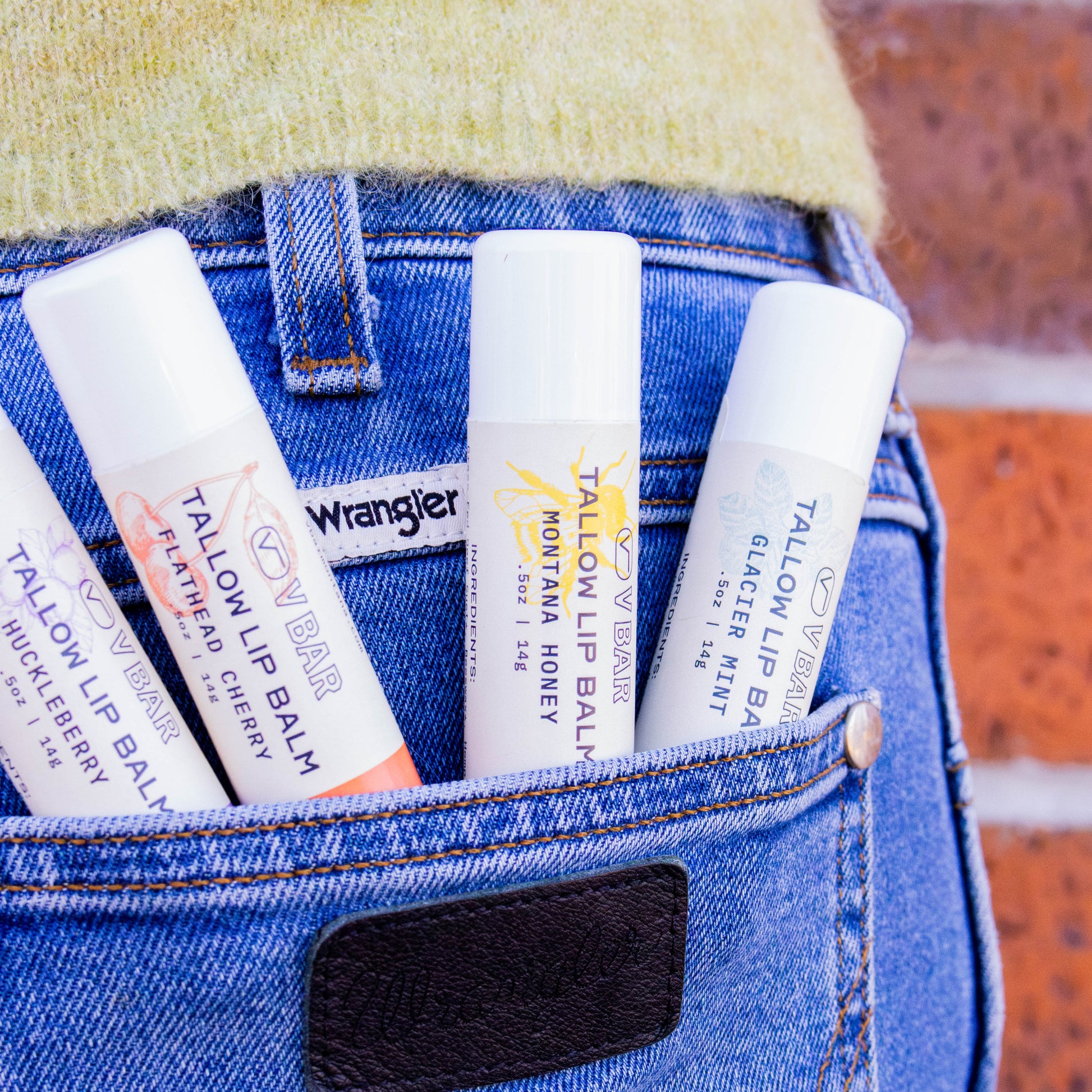 Natural tallow lip balm made from grass-fed beef suet for dry lips and sourced from Montana ranches in the pocket of Wrangler jeans