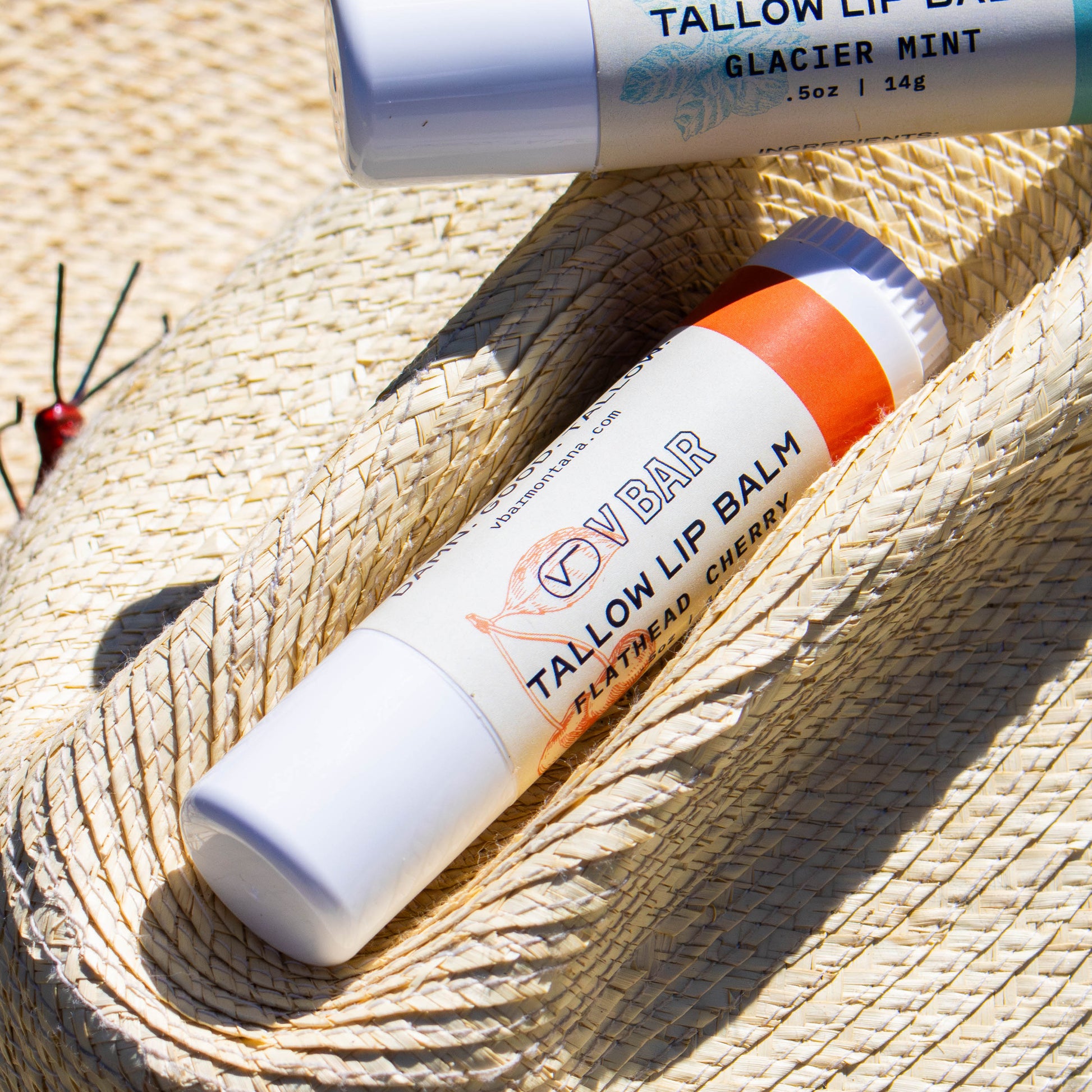 Natural tallow lip balm made from grass-fed beef suet for dry lips and sourced from Montana ranches laying on a star cowboy hat